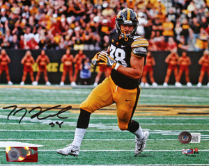 TJ Hockenson Autographed Iowa 8x10 Running Photo-Beckett W Hologram *Black