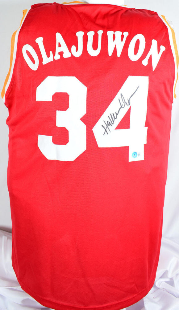 Hakeem Olajuwon Autographed Red Pro Style Jersey- Beckett W Hologram *Black