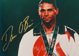 Dan O'Brien Autographed 8x10 With Medal Photo- TriStar Authenticated