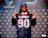 Jadeveon Clowney Autographed 8x10 Holding Texans Jersey Photo- JSA Authenticated