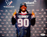 Jadeveon Clowney Autographed 8x10 Holding Texans Jersey Photo- JSA Authenticated