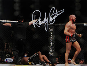 Randy Couture Signed UFC 8x10 Photo With Belt- Beckett Auth *Ref Back Turned