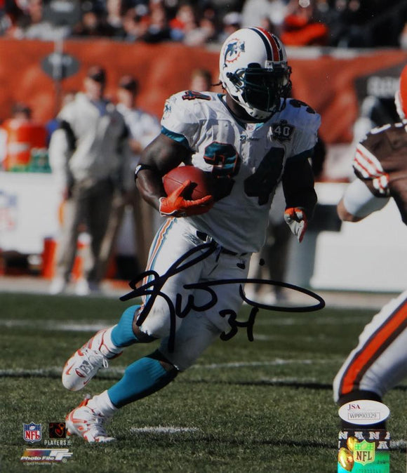 Ricky Williams Autographed Miami Dolphins 8x10 Running PF Photo- JSA W Auth *Blk
