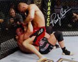 Randy Couture Autographed UFC 16x20 On Top Punching Photo- Beckett Auth *White