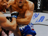 Chuck Liddell Autographed UFC 16x20 Landing Punch Photo- Beckett Auth *Blue