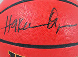Hakeem Olajuwon Autographed Wilson NCAA Basketball-Beckett Auth *Black