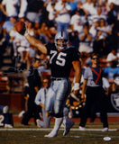 Howie Long Autographed Raiders 16x20 Holding Ball Photo- JSA Witnessed Auth