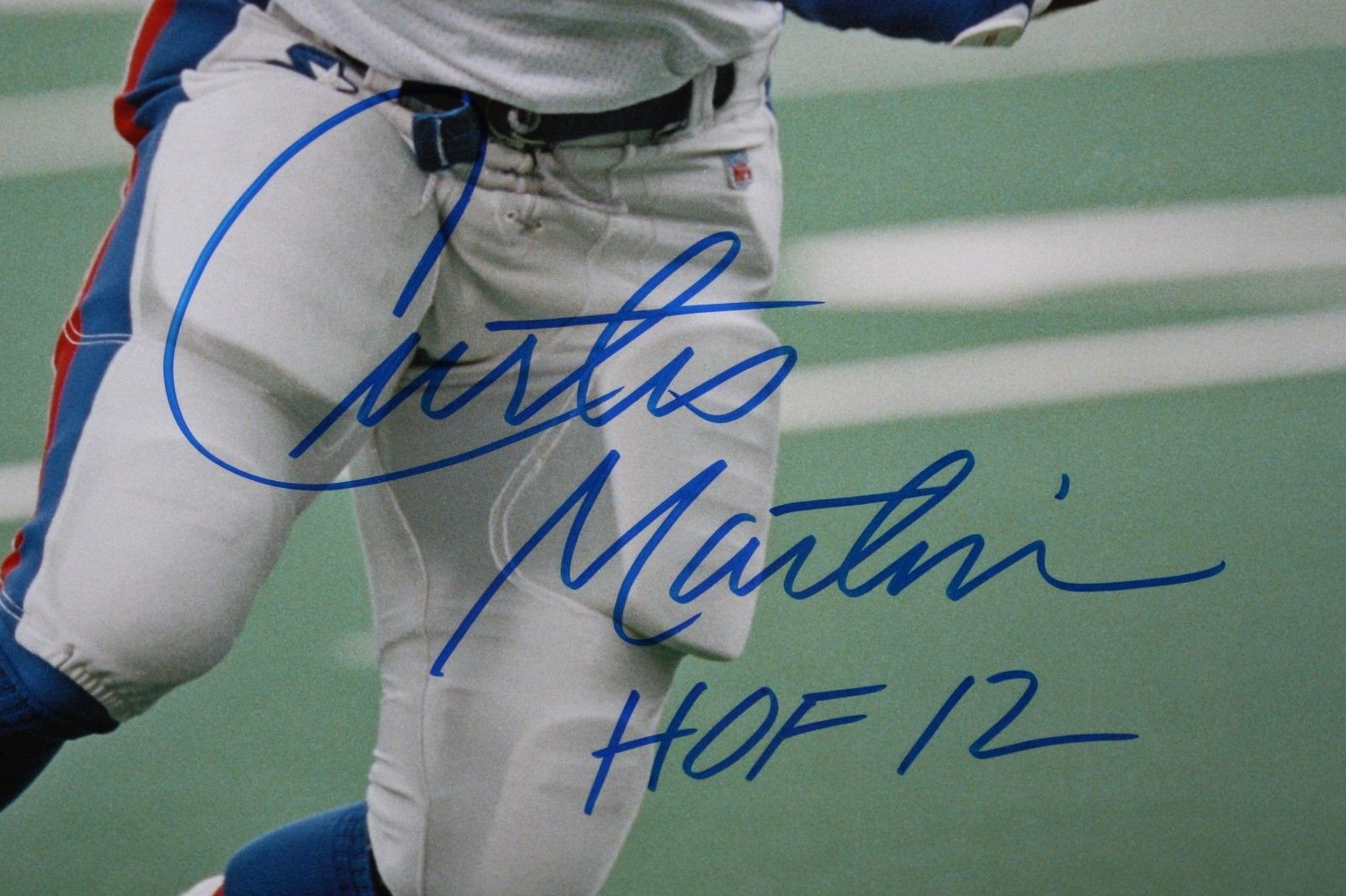 This is a 16x20 Photo that has been hand signed by Curtis Martin