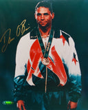 Dan O'Brien Autographed 8x10 With Medal Photo- TriStar Authenticated